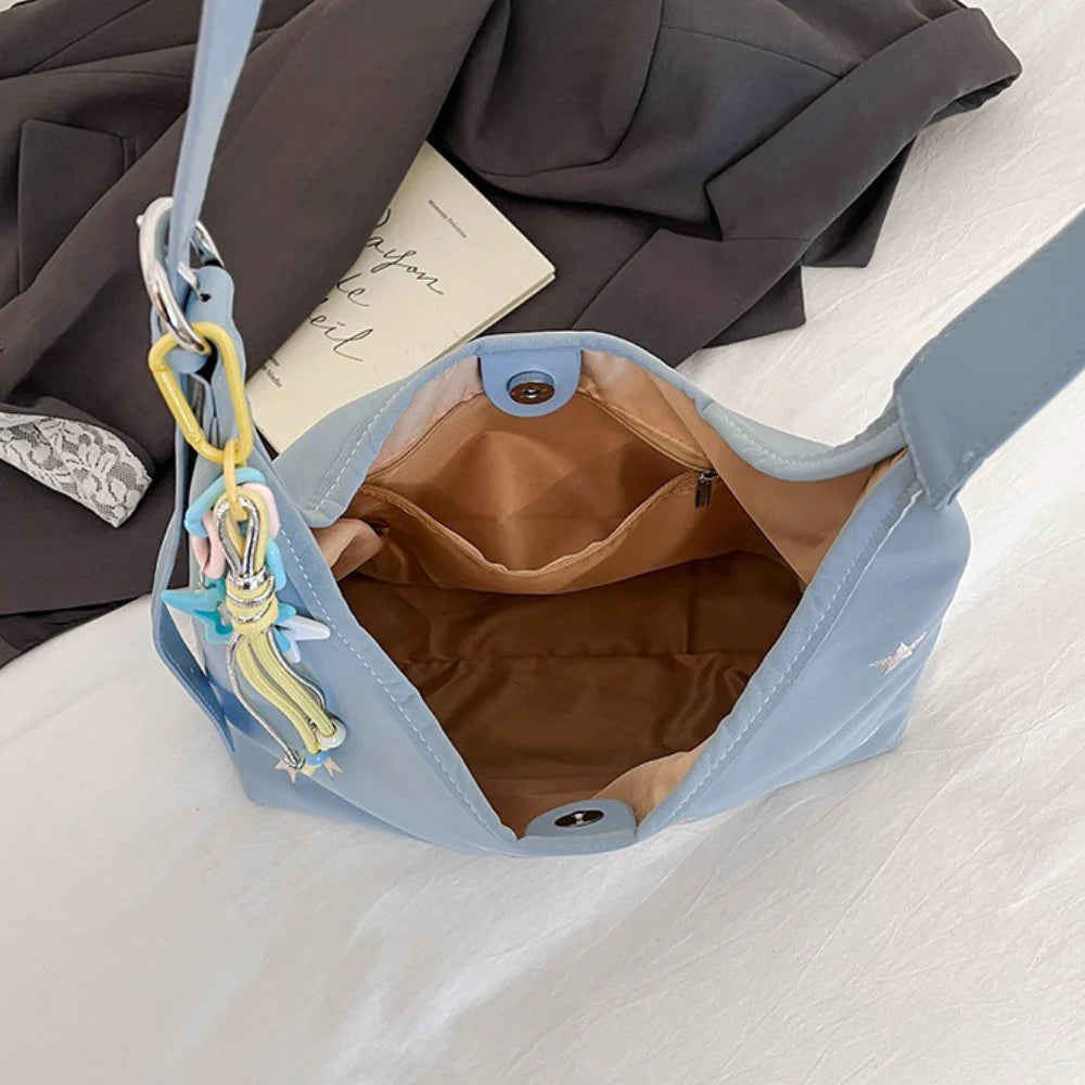 Star Pattern Shoulder Bag with Leather Finish & Star Charm